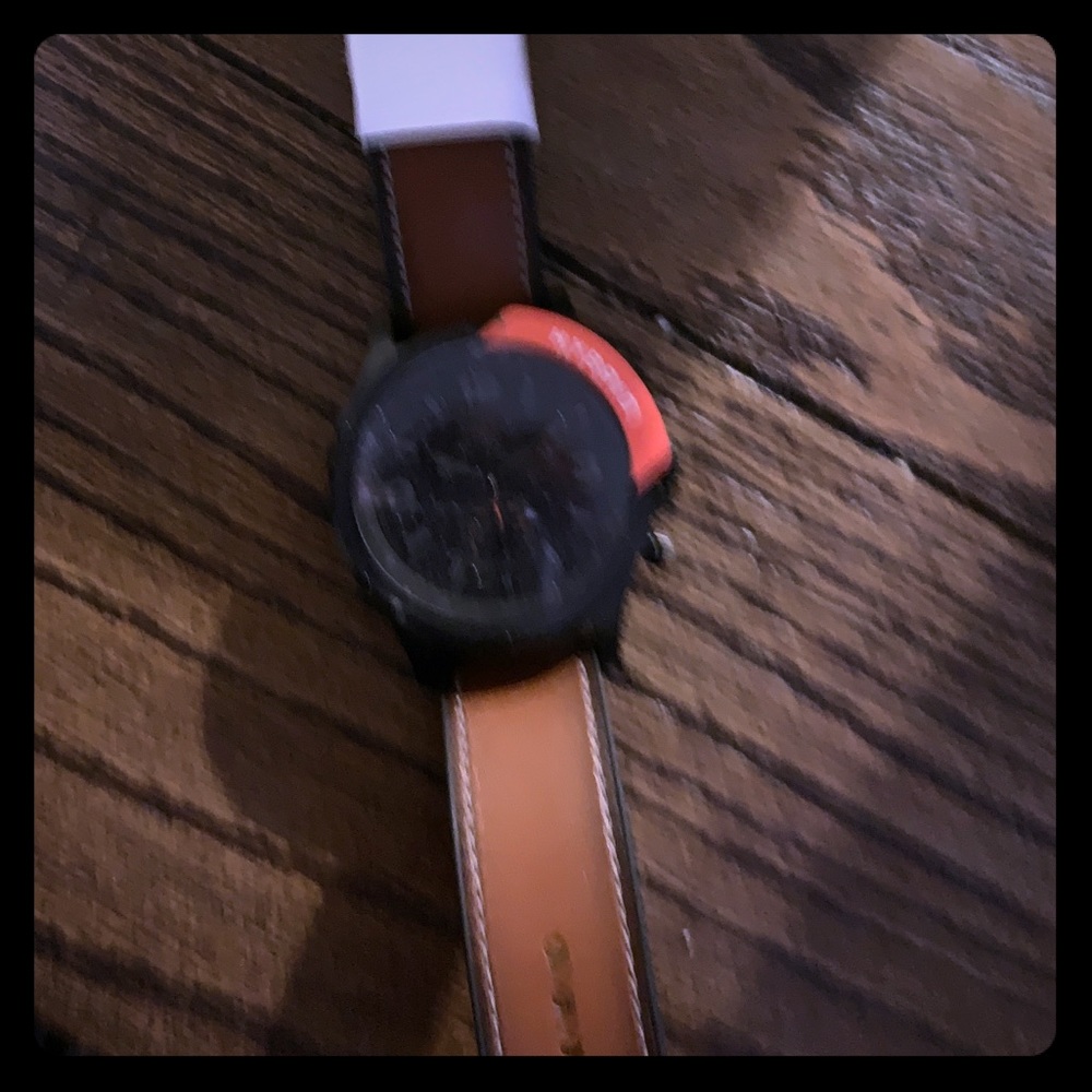 A fossil hybrid smart watch.